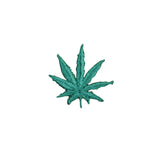 Green cannabis leaf patch on a white background