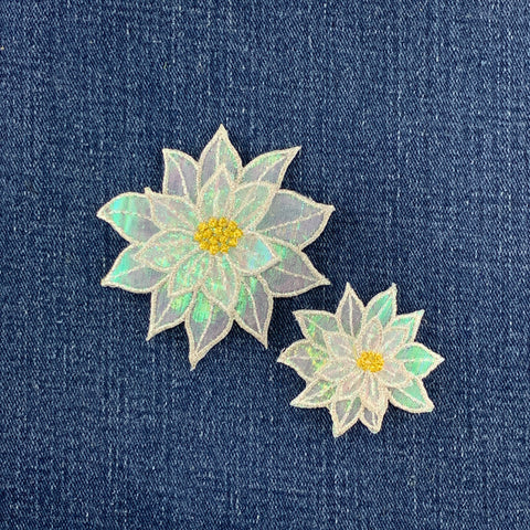 Two floral patches on a denim background