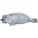 Embroidered patch of a harp seal, depicting a grey seal with realistic details, designed for iron on application.