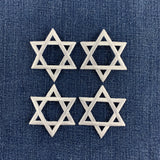 4 white star of David patches on a denim background