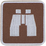 A square brown patch with a white binocular icon on a white background.