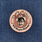 Patch with Will Rogers' face and text on a blue denim background