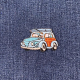 Embroidered vintage car patch on denim fabric