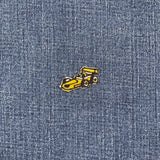 mini yellow racecar patch on a denim background
