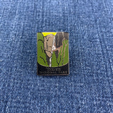 Pin with Yosemite National Park design on a denim background