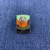Pin with Zion National Park design on a blue denim background