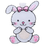 A cute embroidered badge of a white bunny with a pink bow and pink cheeks, designed as a patch to be ironed onto fabric.