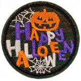 A round embroidered patch with 'Happy Halloween' text, a pumpkin, and spider design. The patch features iron-on adhesive for application.