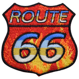 A patch featuring the text 'Route 66' with a background of red flames and blue and yellow accents 
