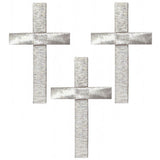 Three silver cross applique patches on a white background.