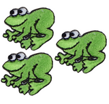 Three miniature green frog applique patches on a white background