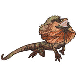Embroidered patch of a Frilled-Neck Lizard, shown mid-display with a large, ruffled neck frill in shades of brown, orange, and green.