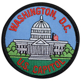Circular embroidered patch featuring a depiction of the US Capitol Building under a light blue sky and over green grass. Red text arches above the building reading "WASHINGTON, D.C." and curves below reading "U.S. CAPITOL.