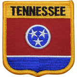 A shield-shaped embroidered patch with the text 'TENNESSEE' at the top and the Tennessee state flag's tristar emblem in the center.