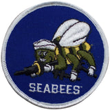 A round embroidered patch featuring a green and yellow figure with the text 'SEABEES' on a blue background.