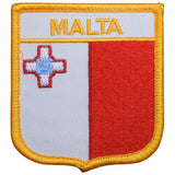 A shield-shaped embroidered patch with the Maltese flag colors and cross, labeled 'MALTA', with a gold border.