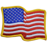 A large wavy American flag patch with a yellow border, designed to be ironed onto fabric.