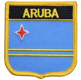A shield-shaped patch with a blue background, yellow stripes, and the name 'ARUBA' in bold letters, along with a red star.