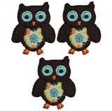 Three owl applique patches with colorful detail and iron on badges, displayed on a white background.