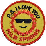 A round patch with a design that includes a sun wearing sunglasses and the text 'P.S. I LOVE YOU PALM SPRINGS'