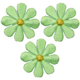 Three embroidered patches depicting lime green daisies with yellow centers, arranged separately against a white background.