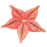 A embroidered starfish applique patch in pink, orange, and yellow colors with an iron on backing.