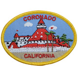 Oval embroidered patch for Coronado, California, featuring the distinctive red turreted roof and white walls of the Hotel del Coronado.