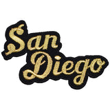 A patch with the text 'San Diego' in a cursive gold font outlined with black.