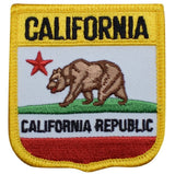 A shield-shaped patch with a grizzly bear, featuring the words 'California' and 'California Republic', a red star, and a gold border.