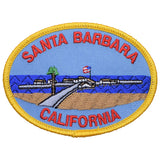 An oval-shaped patch featuring the text 'Santa Barbara California' with an illustration of a beach and pier. 