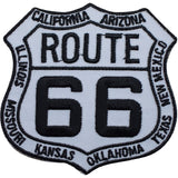 A shield-shaped patch with 'ROUTE 66' written in bold letters, surrounded by the names of US states in a circular pattern, and a badge number '66' in the center.