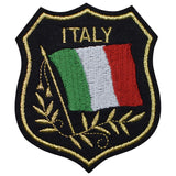 A shield-shaped patch with the Italy flag colors and the text 'ITALY' on top. It is embroidered with gold details around the edge.