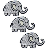 Three embroidered patches depicting miniature elephants in a grey scale color, designed to be ironed onto fabric.