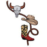 a cowboy themed applique patch featuring a bull skull, cowboy hat, cowboy boot, and a rope