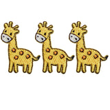 Three embroidered patches depicting yellow giraffes with spots, arranged side by side.