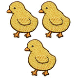Three yellow mini chick applique patches with brown details on a white background, designed to be ironed onto fabric.