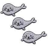 three gray embroidered seal patches on a white background