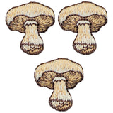 Three embroidered patches depicting the image of a mushroom with a brown cap and white stem, arranged in a triangular formation.
