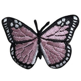 A pink butterfly embroidered patch with black details 