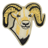 A large embroidered patch depicting a ram's head with horns, primarily in beige, black, and yellow colors.