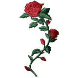 A medium-sized red rose applique patch with green leaves and buds, designed to be ironed onto fabric.