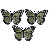 Three olive green butterfly applique patches with black and white accents, designed to be ironed onto fabric.