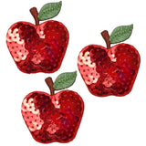 Three red apple-shaped applique patches with green leaves, made of sequins, designed to be iron on.