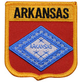 An embroidered patch with a shield shape, featuring the text 'ARKANSAS' across the top. The patch has a blue and gold design with a red background.
