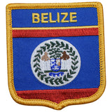 A shield-shaped embroidered patch with the Belize flag, including the coat of arms, and the text 'BELIZE' at the top.