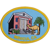 Embroidered patch of the historic Benicia Capitol building with a camel and palm tree on a white background