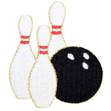A bowling themed applique patch featuring a bowling ball and two white bowling pins with red stripes on them.