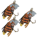 Three embroidered patches depicting fly fishing lures with hooks, wings, and detailed patterns