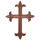 A brown cross applique patch with an intricate design suitable for iron on application.