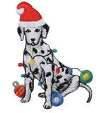 A Dalmatian applique patch with Christmas lights and a red Santa hat ironed onto a white background.